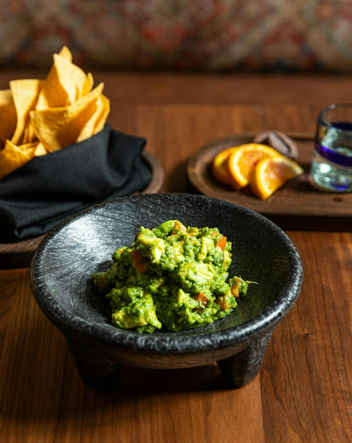 a bowl of food sitting on top of a wooden table