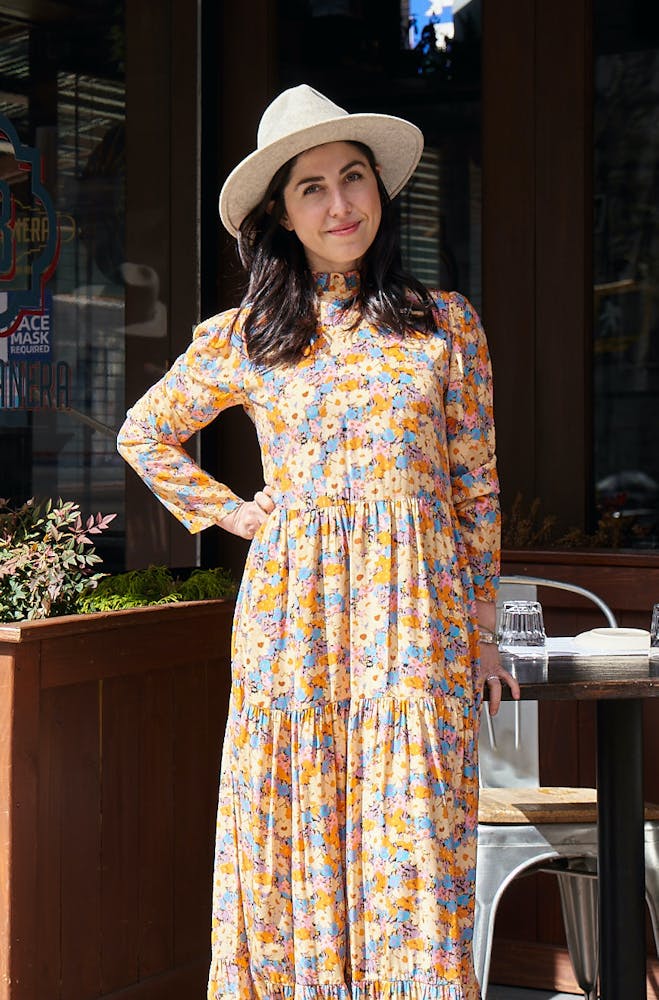 a woman standing in front of a building