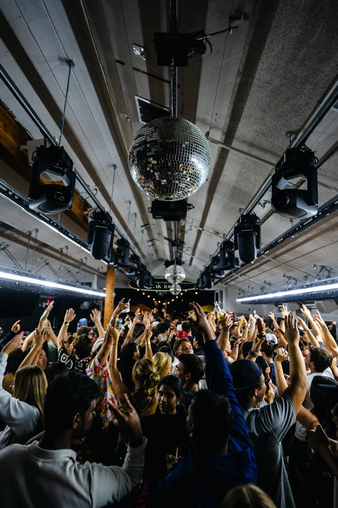 a group of people standing in front of a crowd