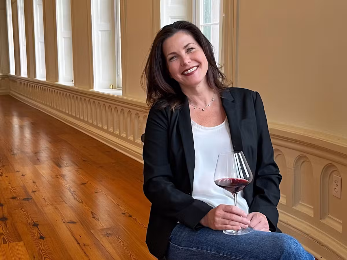 Vonda Freeman with a glass of wine