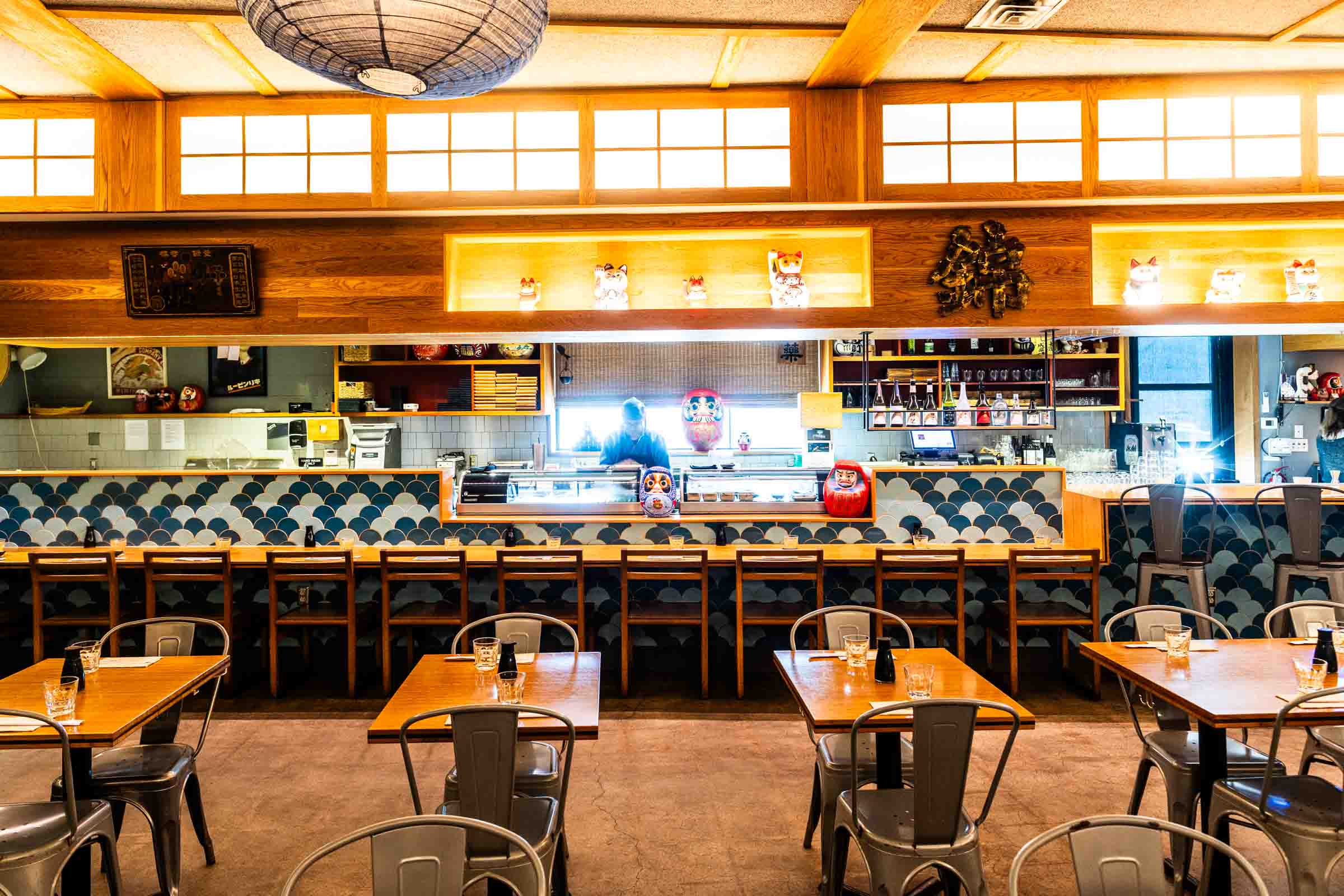 a group of people sitting at a table in a restaurant