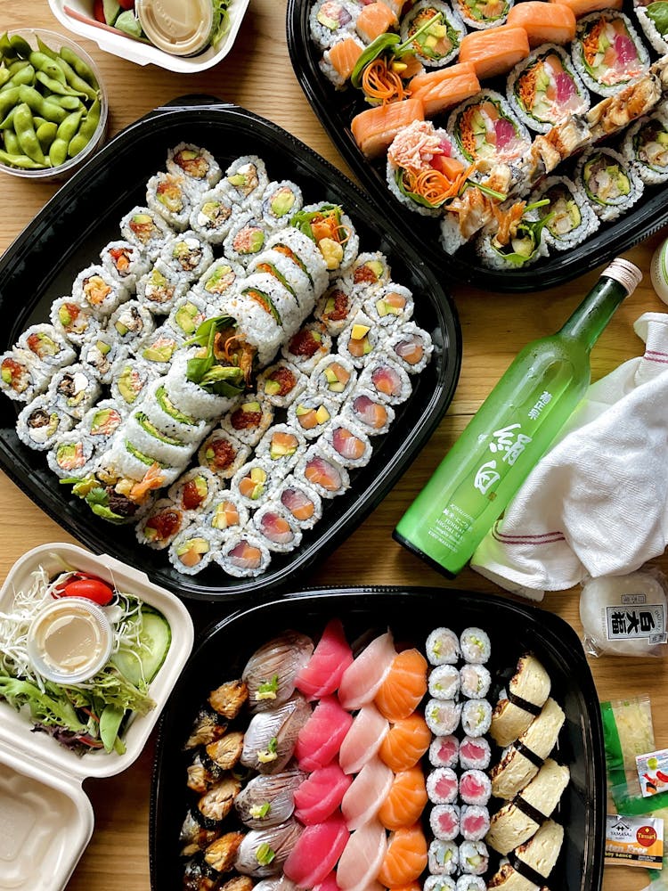 a bunch of food sitting on top of a wooden table