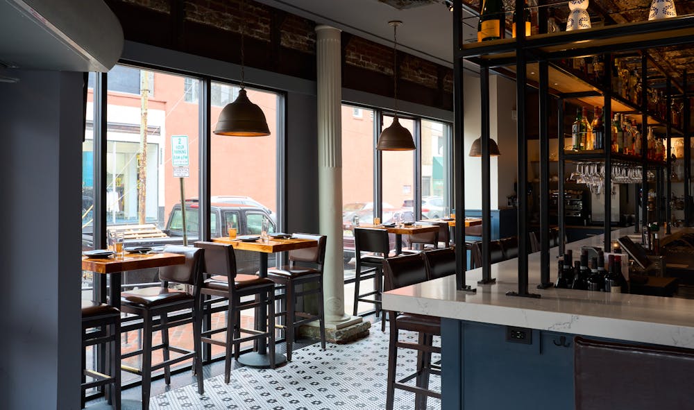 a dining room table in front of a window