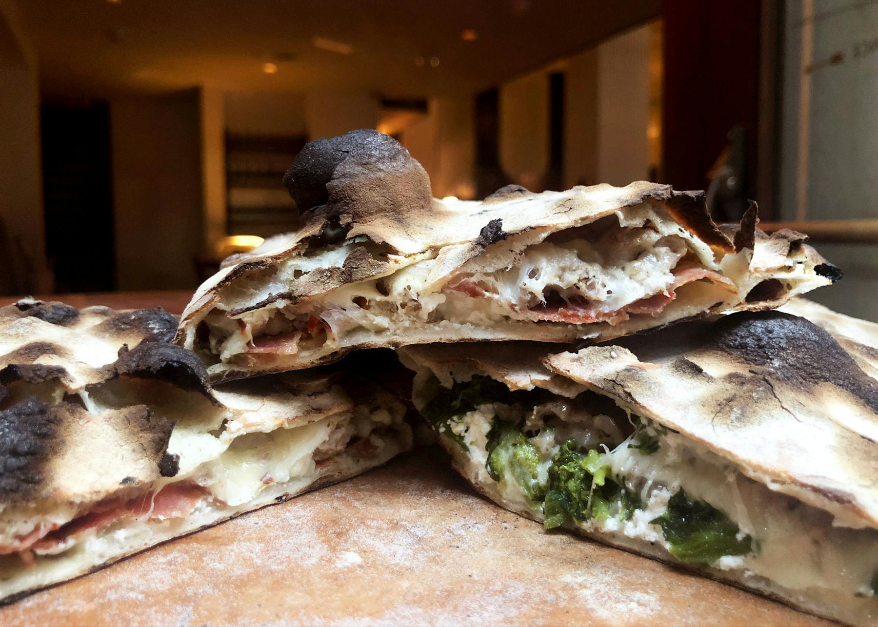 Three Calzones on a table