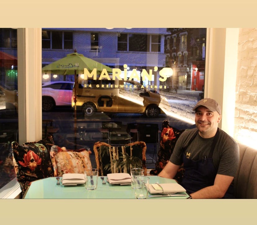 a man and a woman sitting at a table in a restaurant