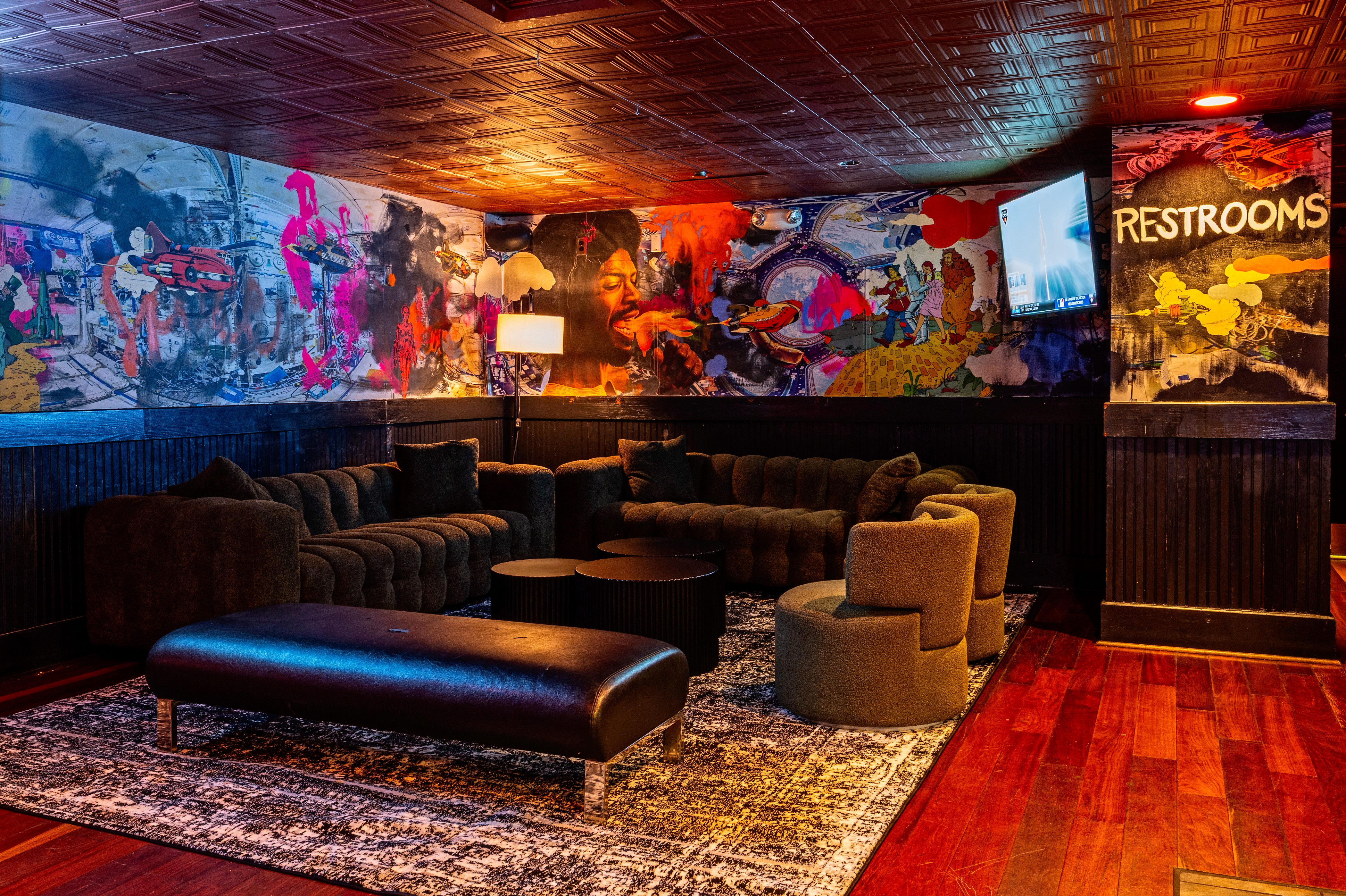 a living room filled with furniture and a rug
