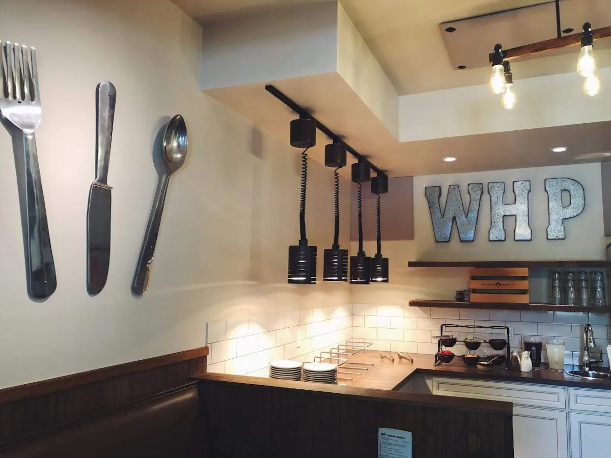 a kitchen with a table and looking at the camera