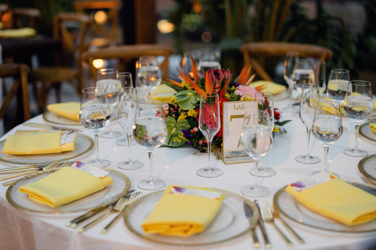 a dining table filled with wine glasses