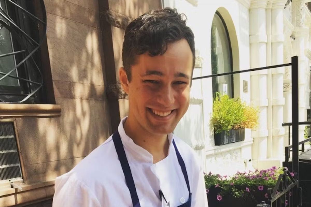 a man standing in front of a building
