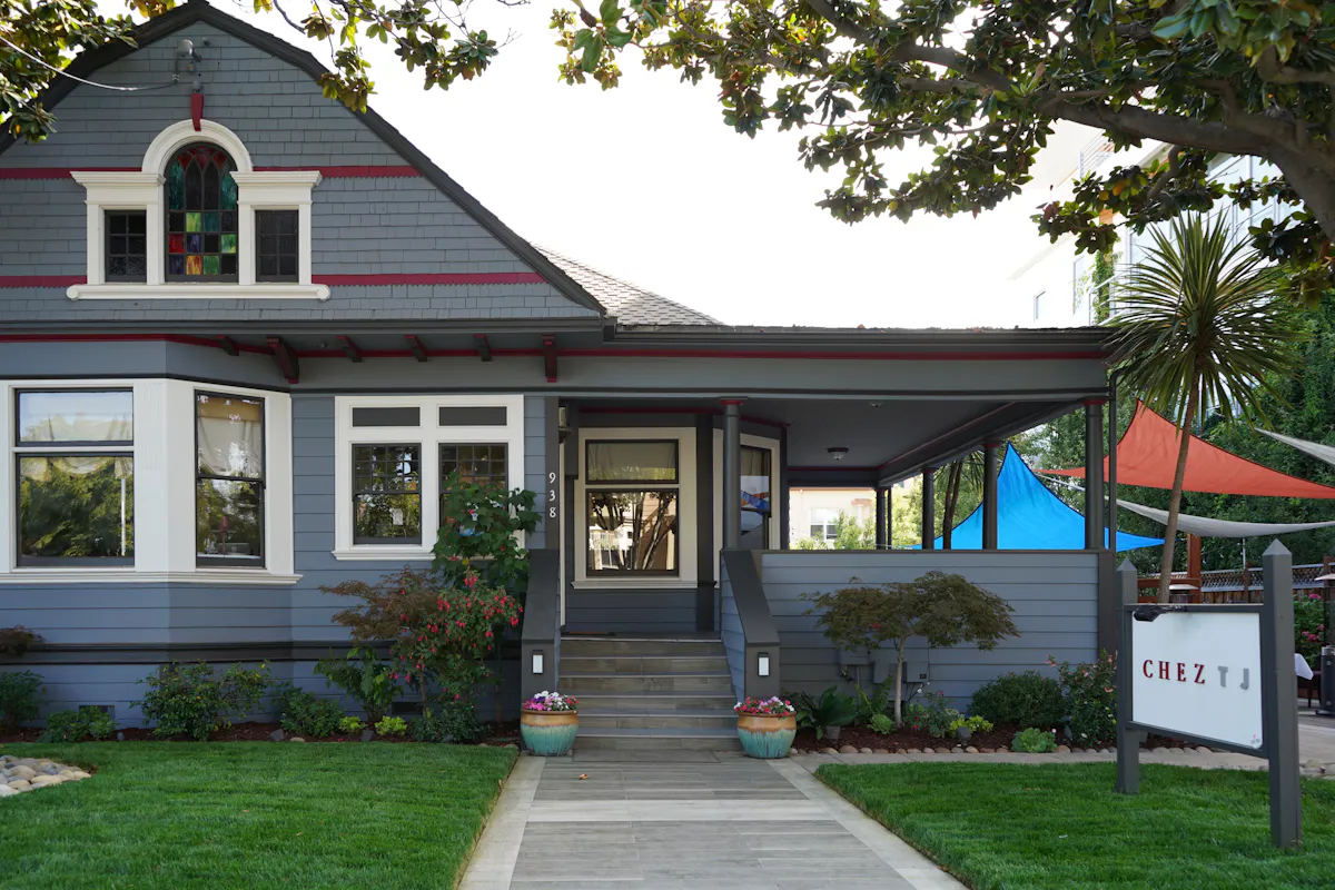 a house with a lawn in front of a building