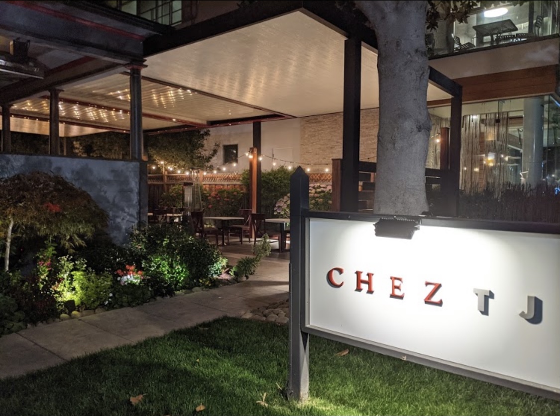 a sign in front of a building