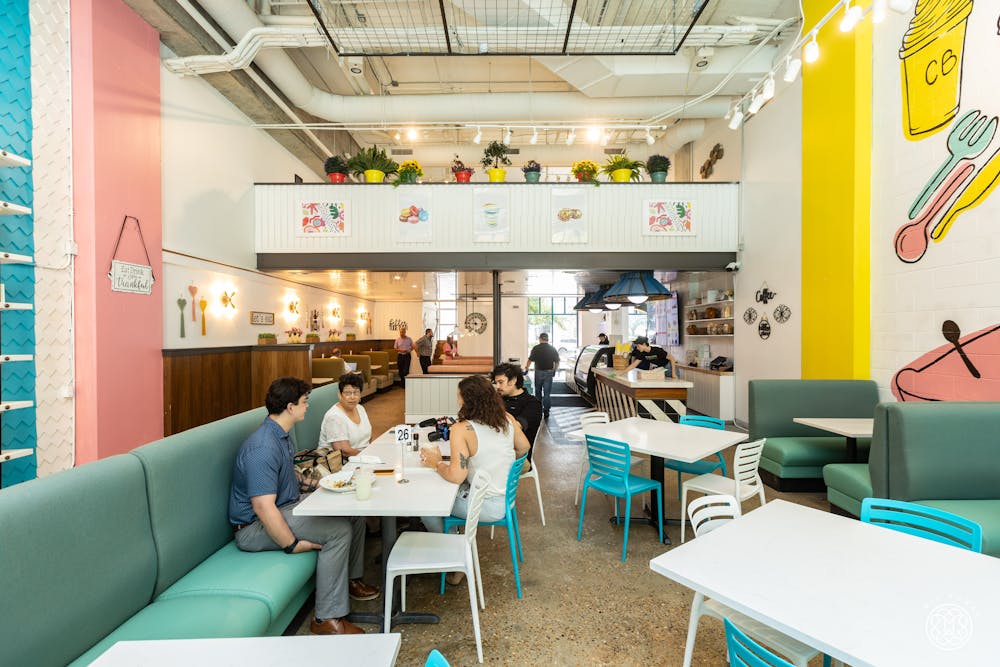 a person sitting at a table in a room