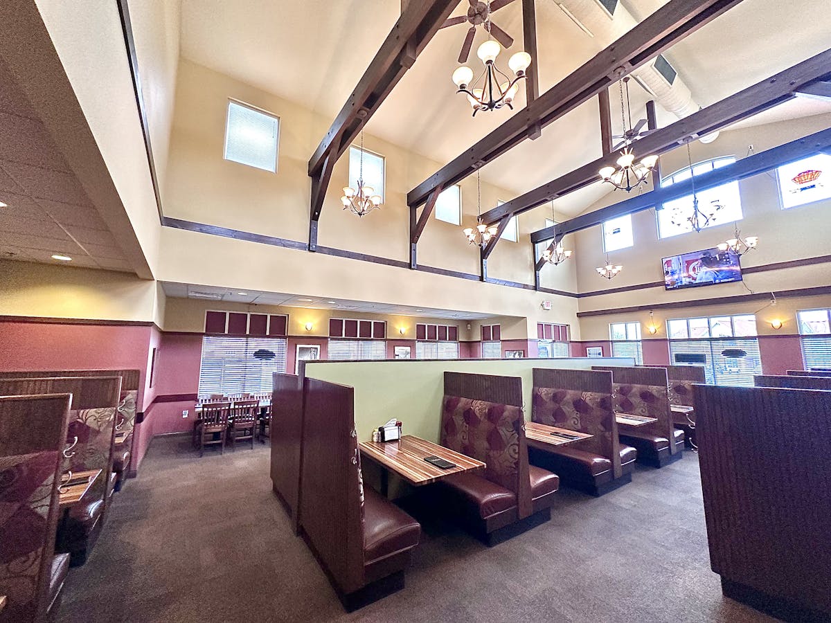 a room filled with furniture next to a building