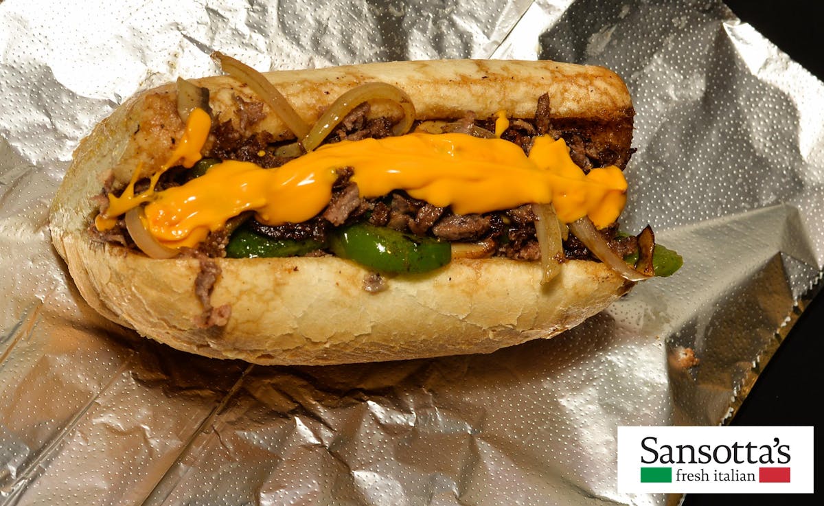 a close up of a philly cheese steak