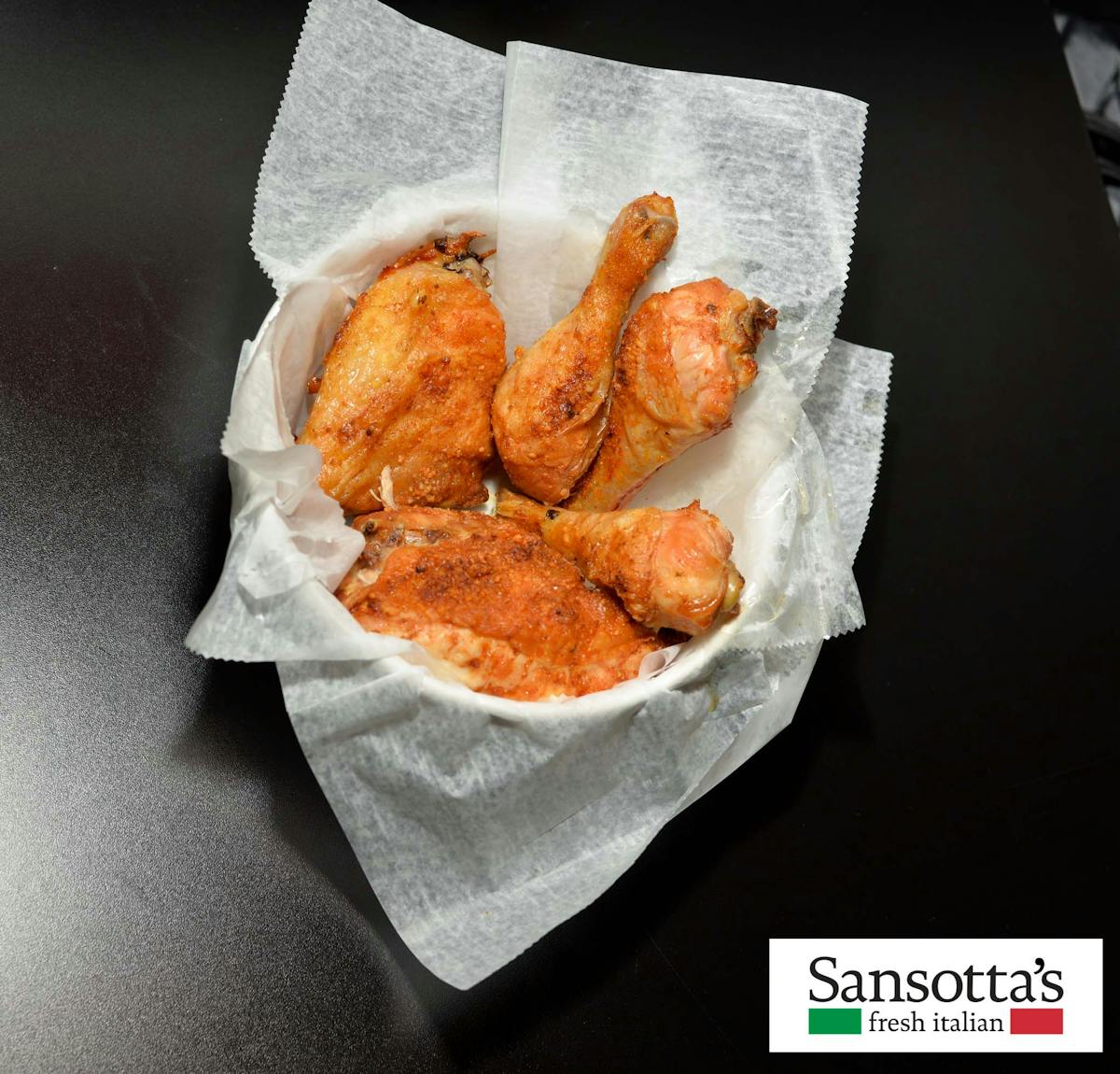 a basket filled with chicken pieces