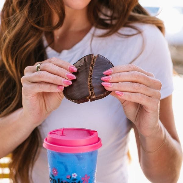 a woman eating a donut