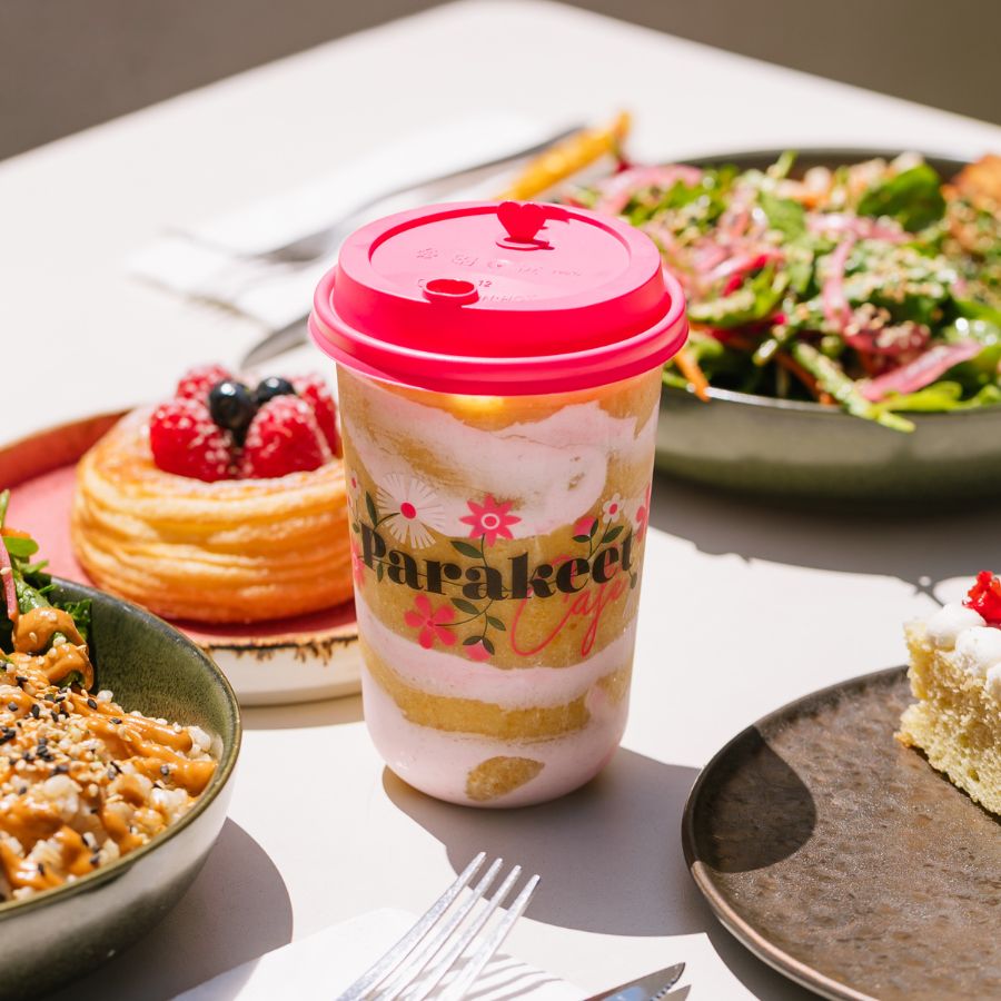 a plate of food with a slice of cake on a table
