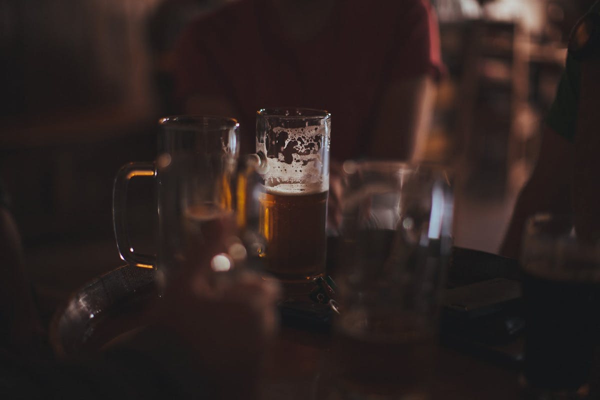 a glass of beer on a table