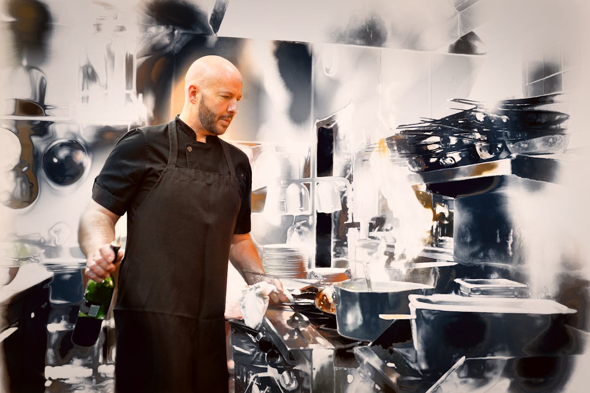 a man standing in a kitchen preparing food