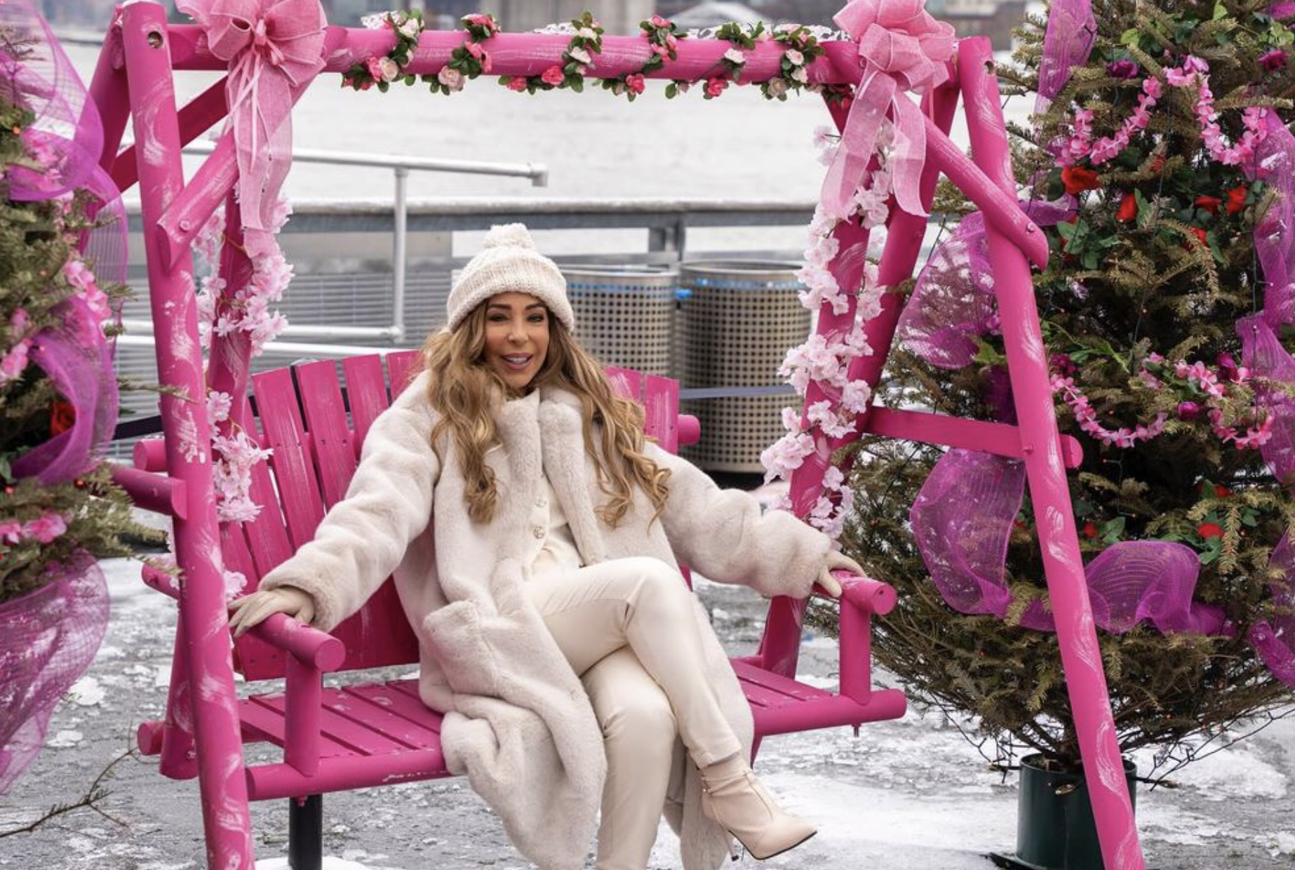 Pink-themed glasshouse seating with seasonal décor.
