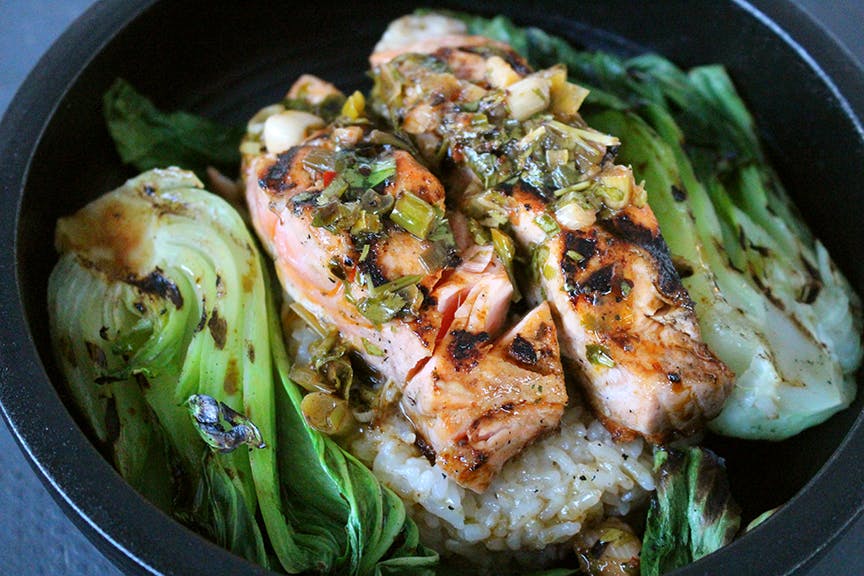 a bowl of food with broccoli