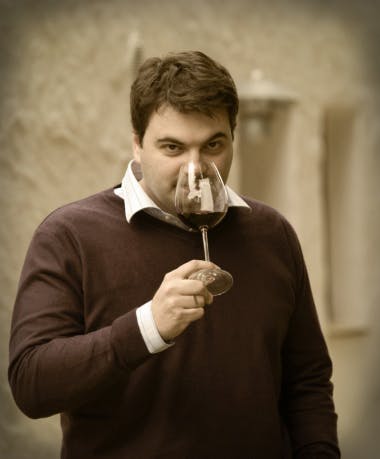 a man standing in front of a mirror posing for the camera