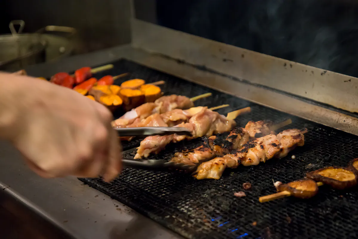 grilling yakitori skewers