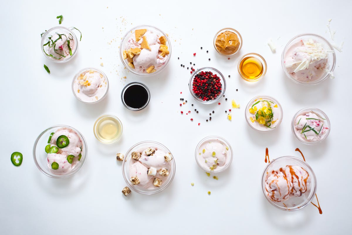 a table topped with ice cream plates