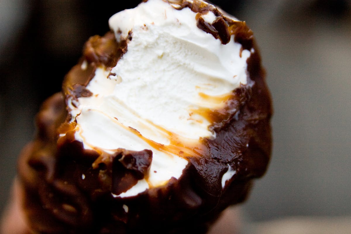 a close up of a bitten ice cream