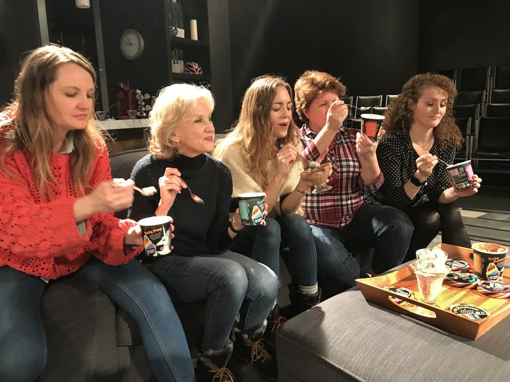 a group of women eating ice cream 