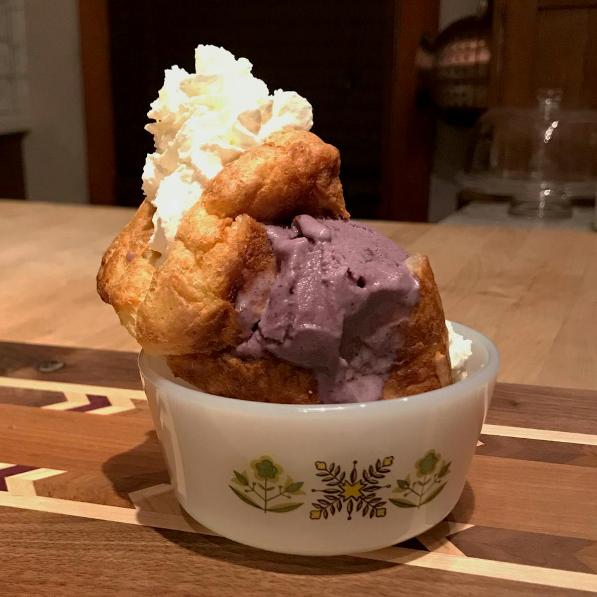 a cup of ice cream and whipped cream