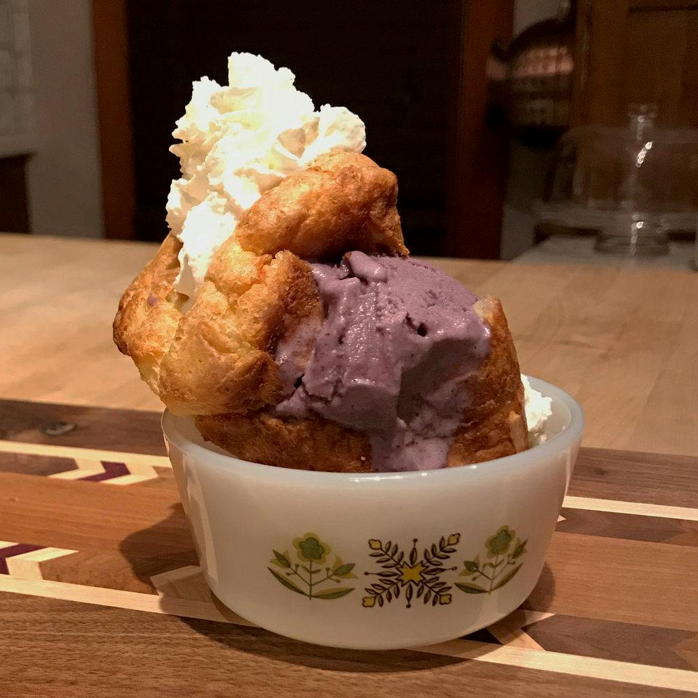 a cup of ice cream and whipped cream