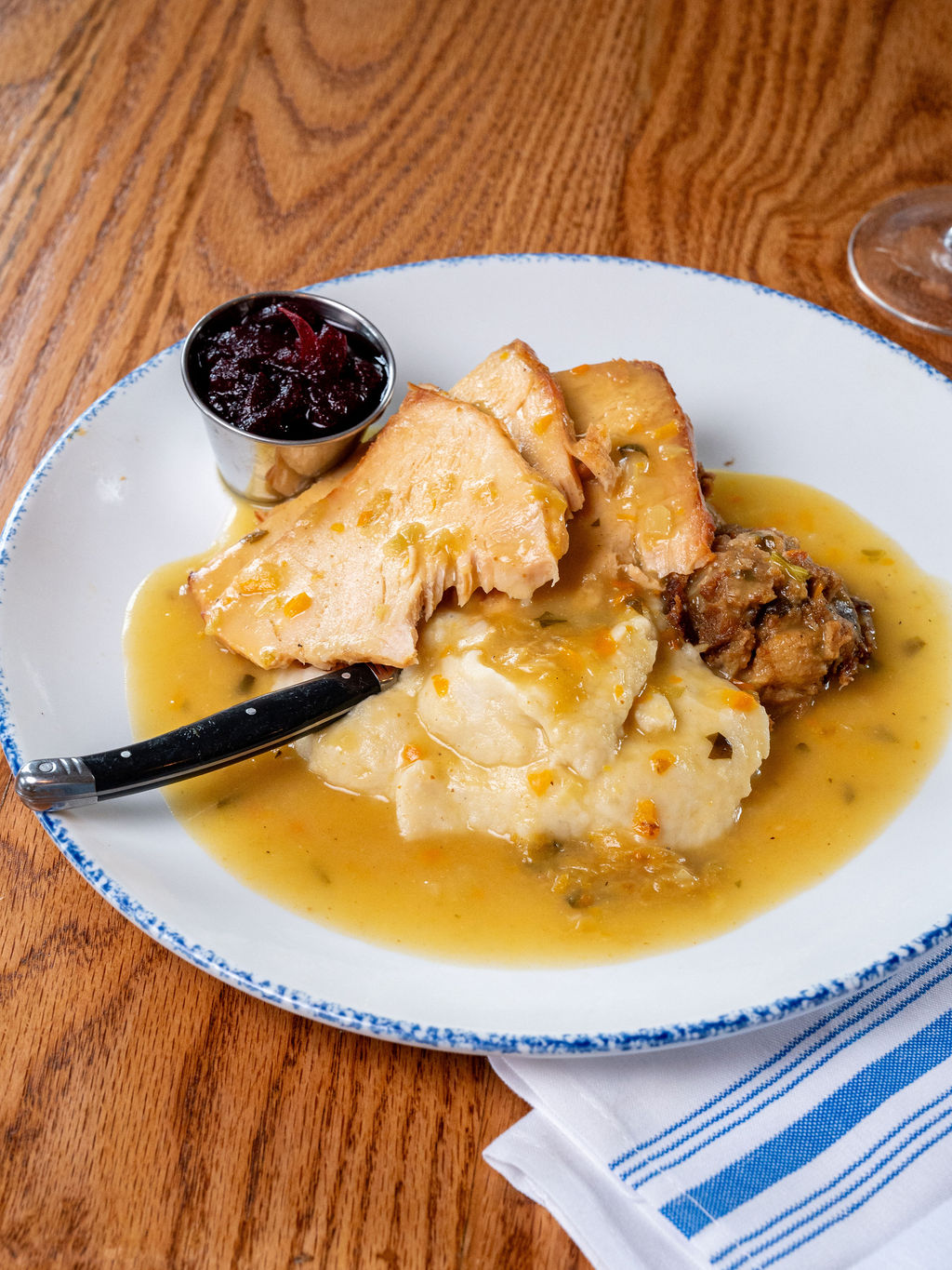 a plate of food with a fork and sauce