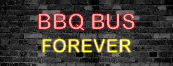 a sign in front of a brick building