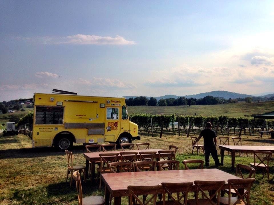 a yellow truck is sitting in the grass