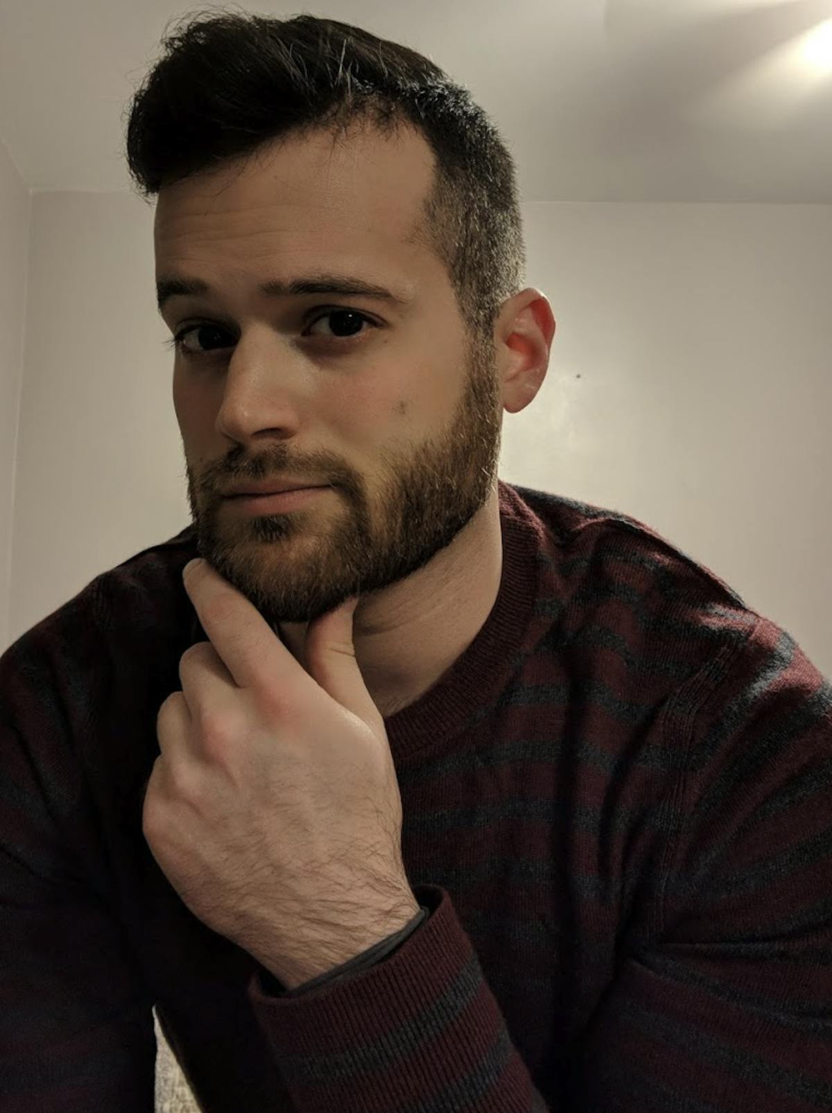 a man wearing glasses and looking at the camera