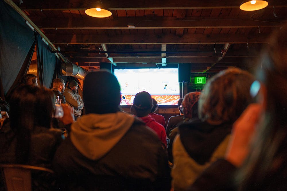 a group of people standing in a room