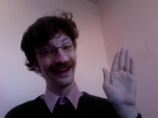 a man standing in front of a mirror posing for the camera