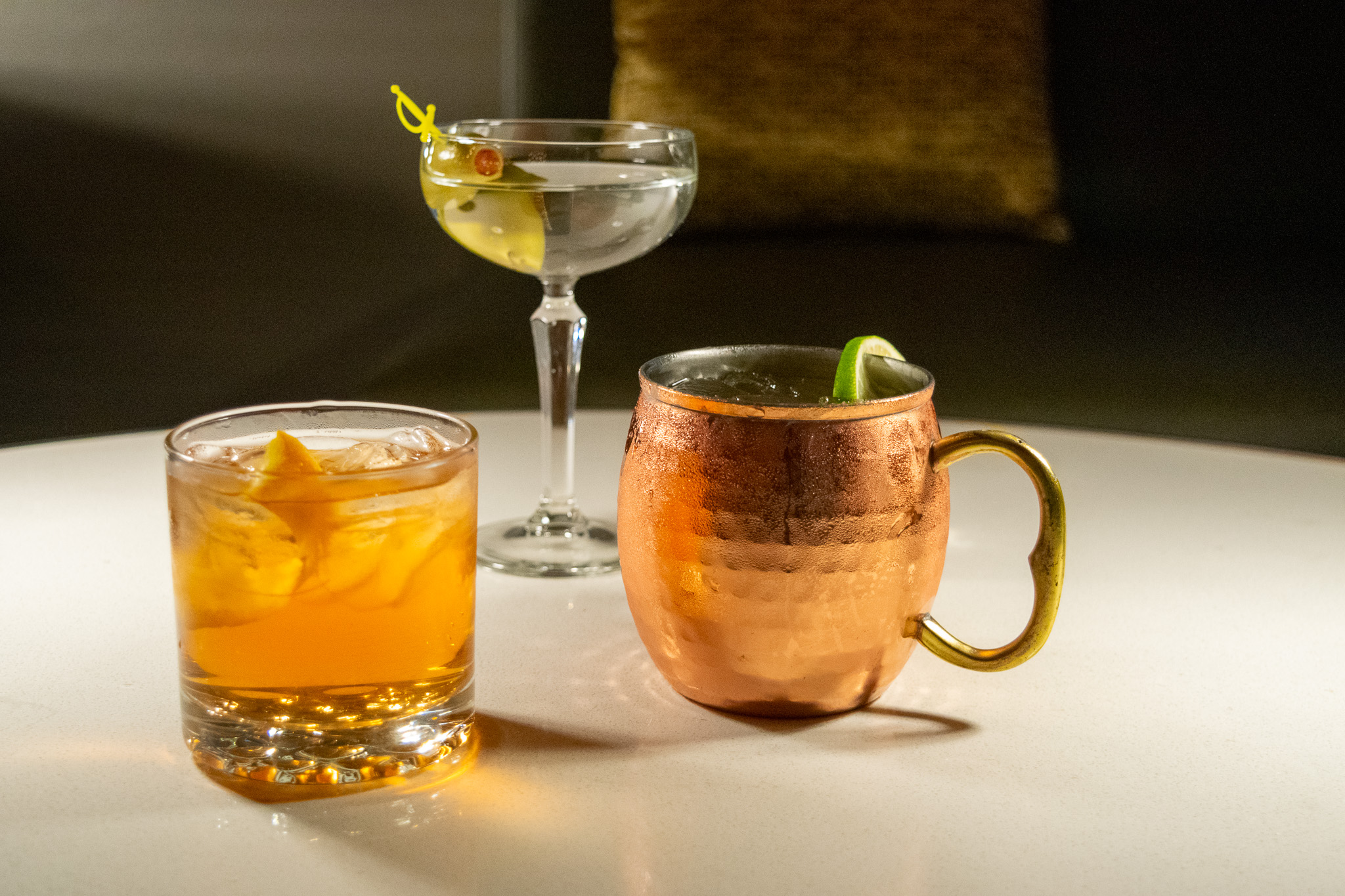 Three cocktails on a white table at The Forge in Downtown Neenah