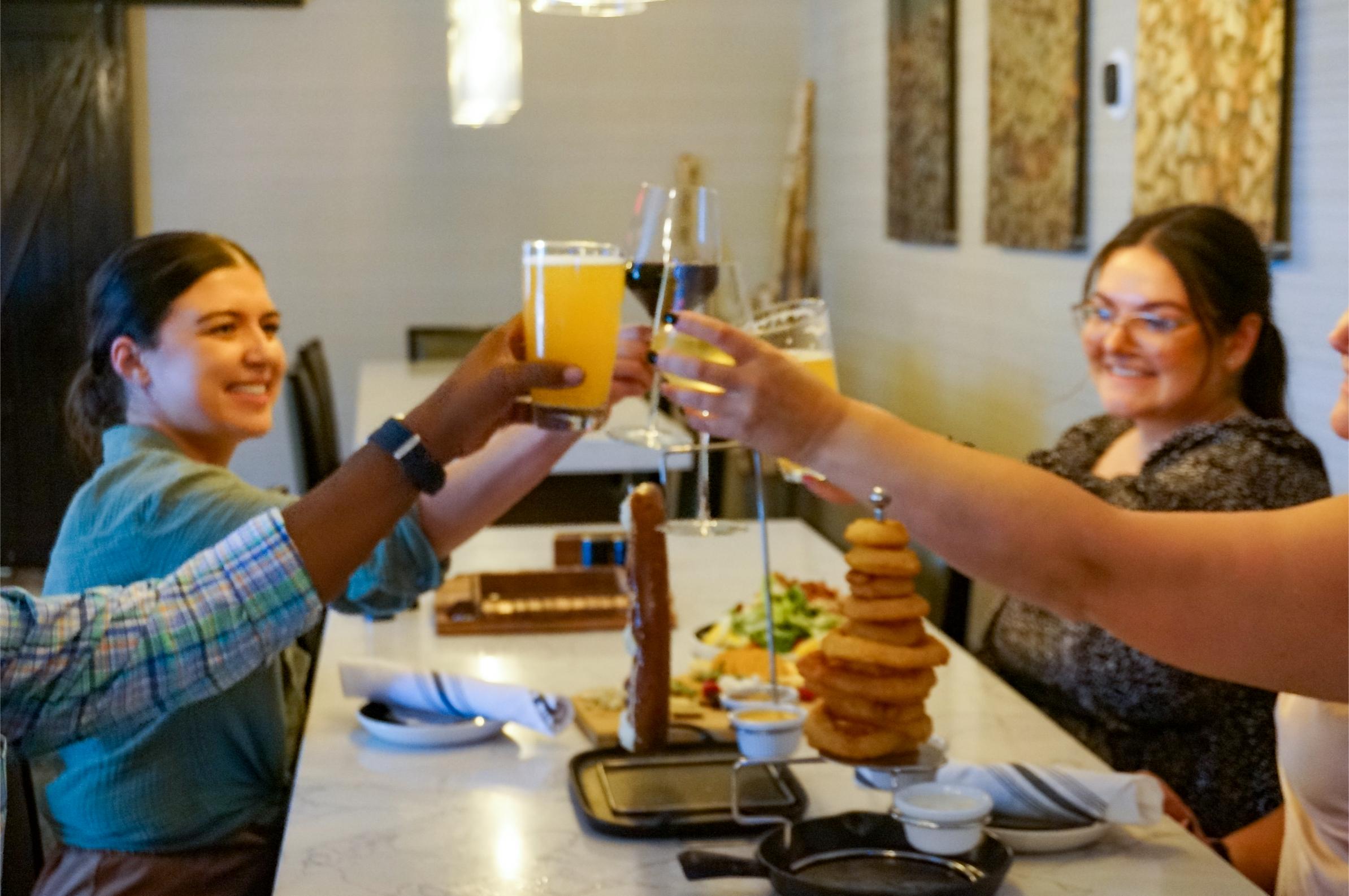 a group of people holding drinks