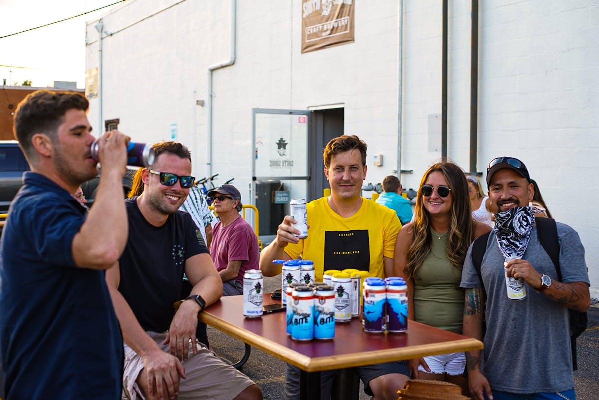 a group of people drinking wine at a restaurant