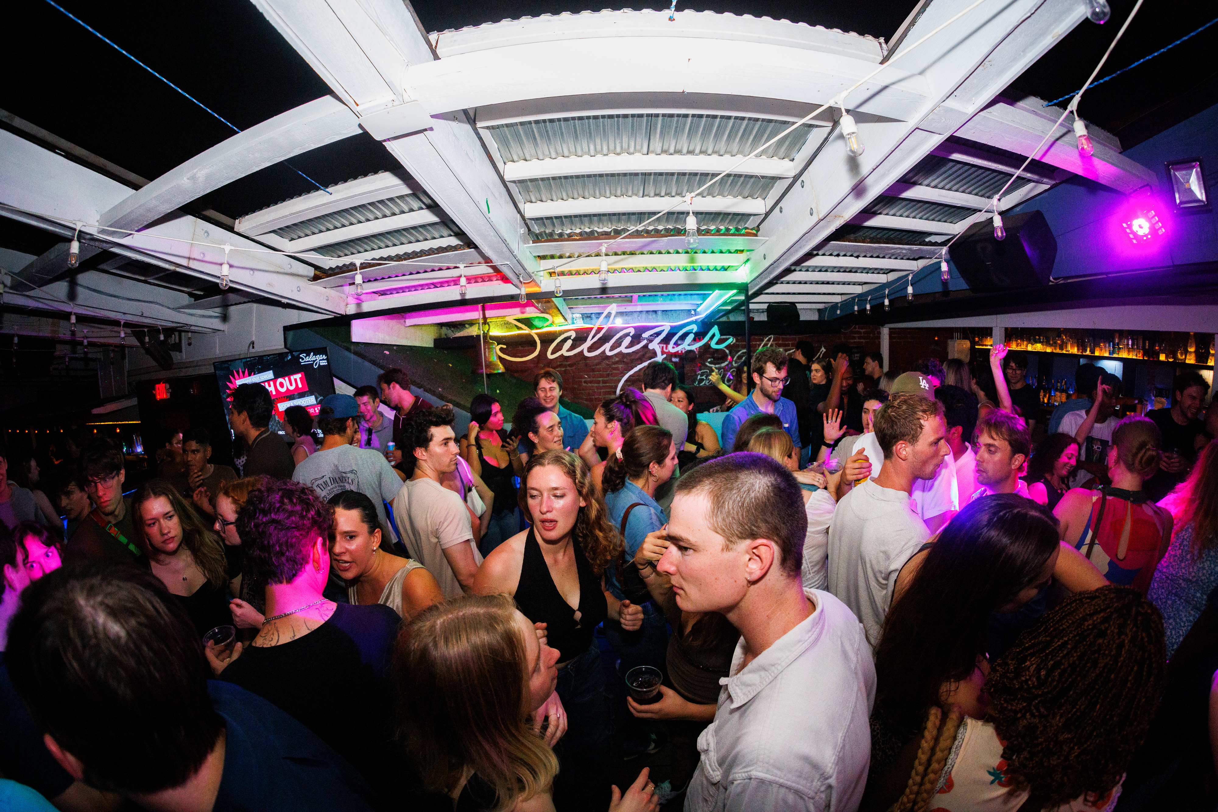 a group of people standing in front of a crowd