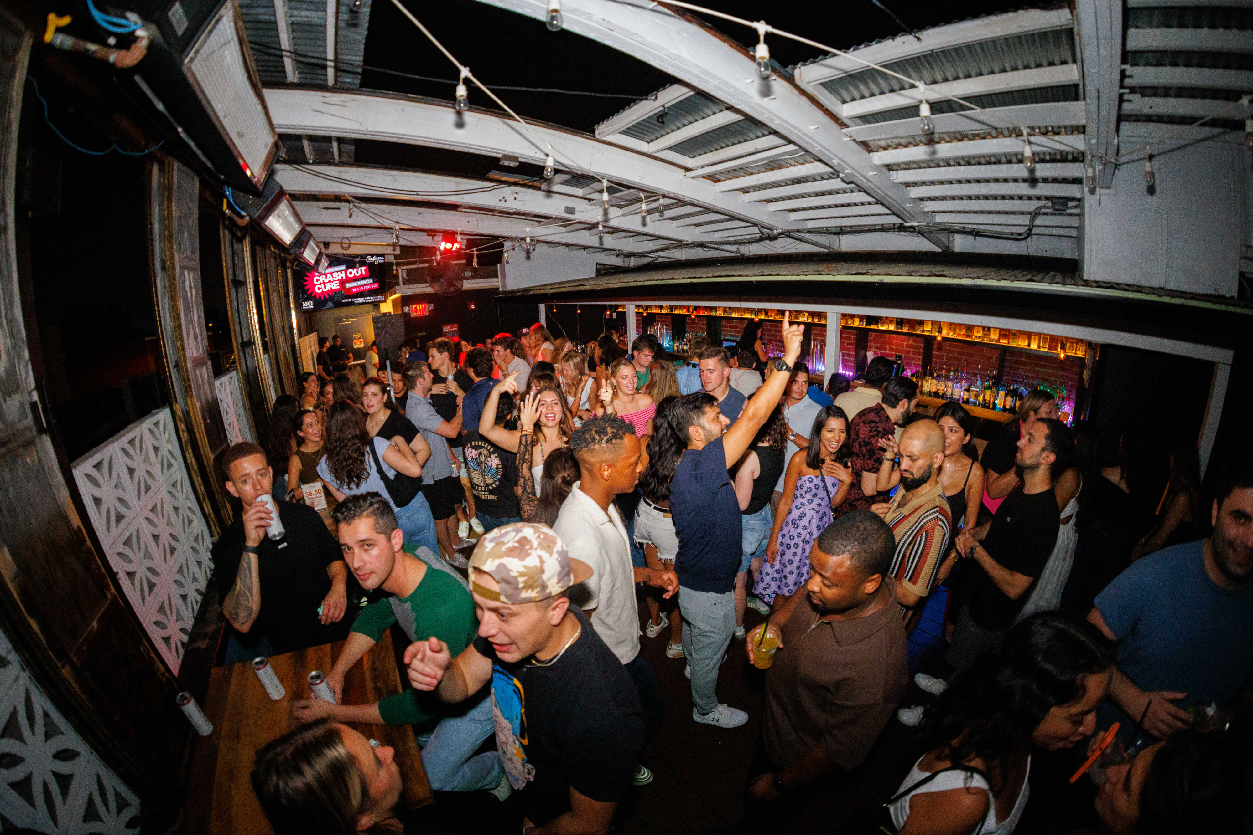 a group of people standing on top of a ramp