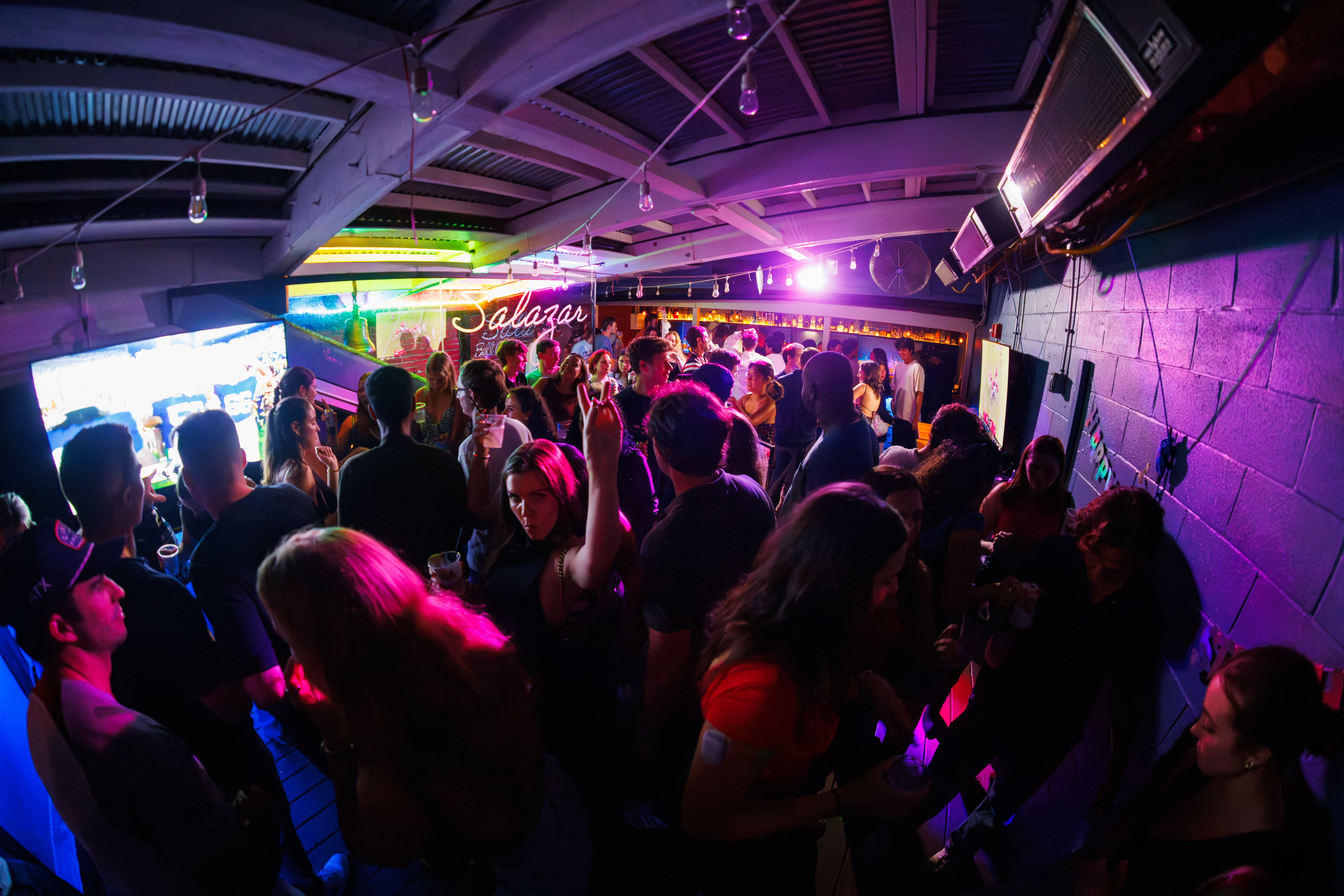 a group of people on a stage in front of a crowd