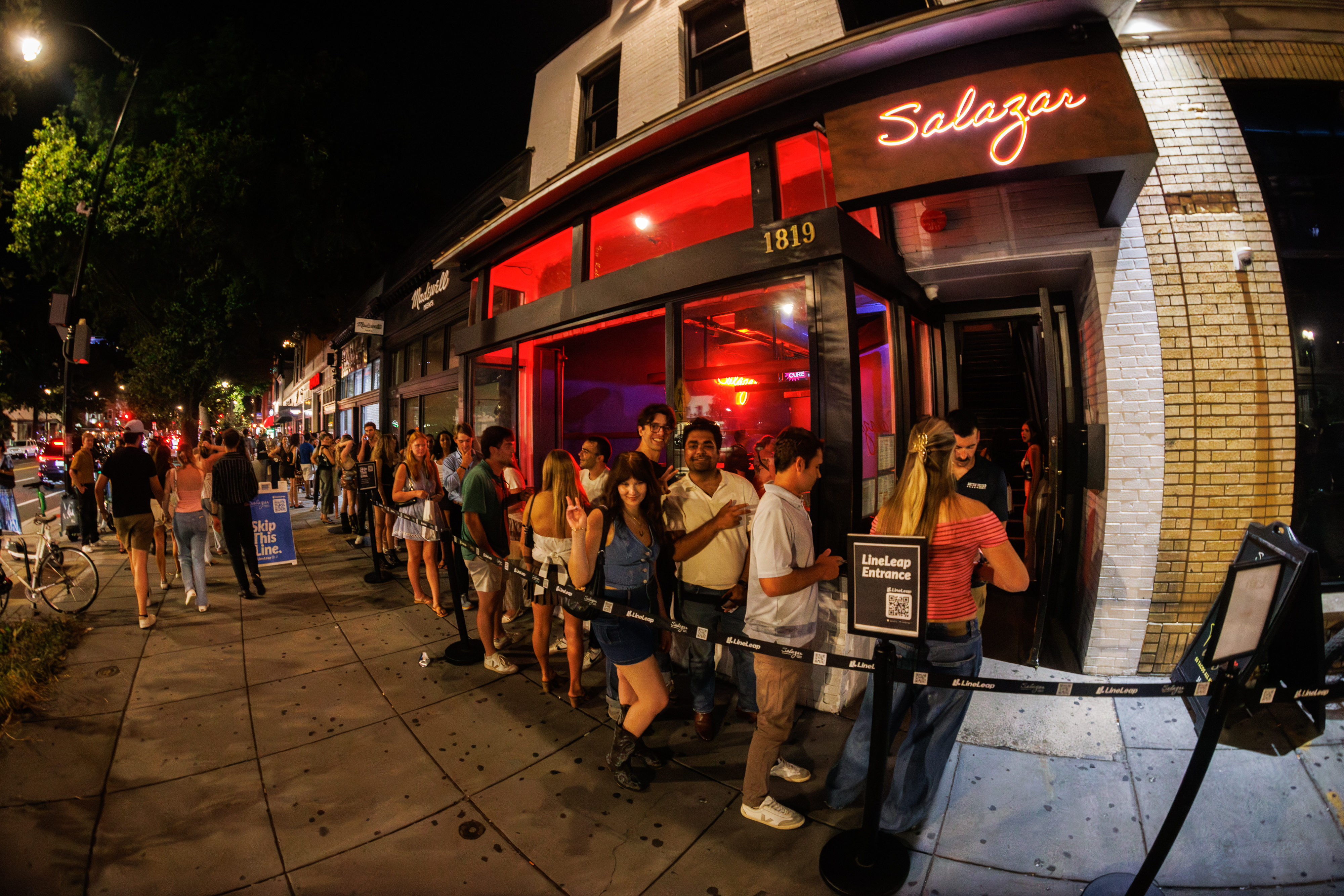 a group of people standing in front of a building