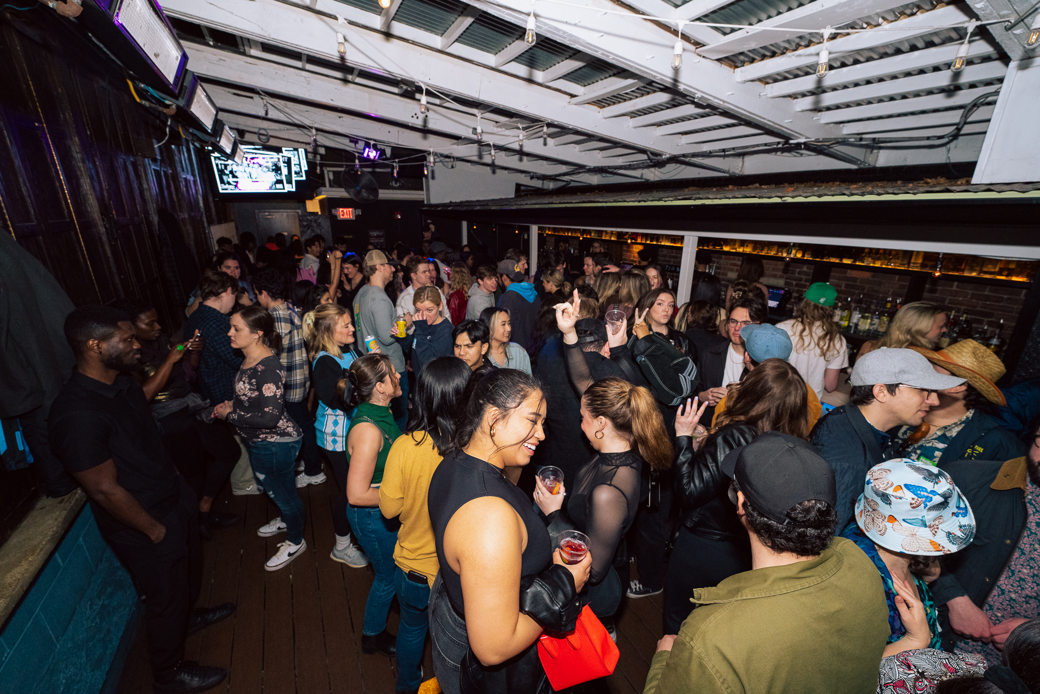 a group of people sitting at a train station