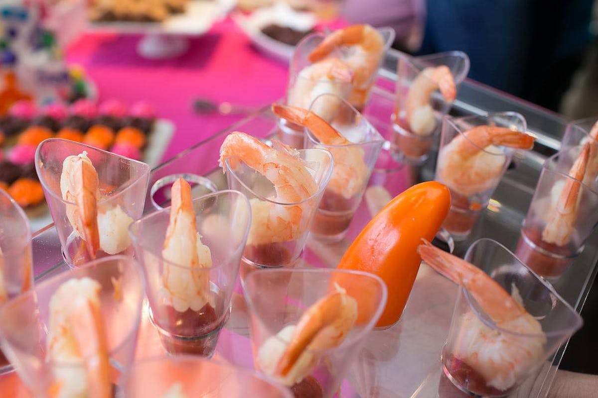 a group of plastic containers filled with food