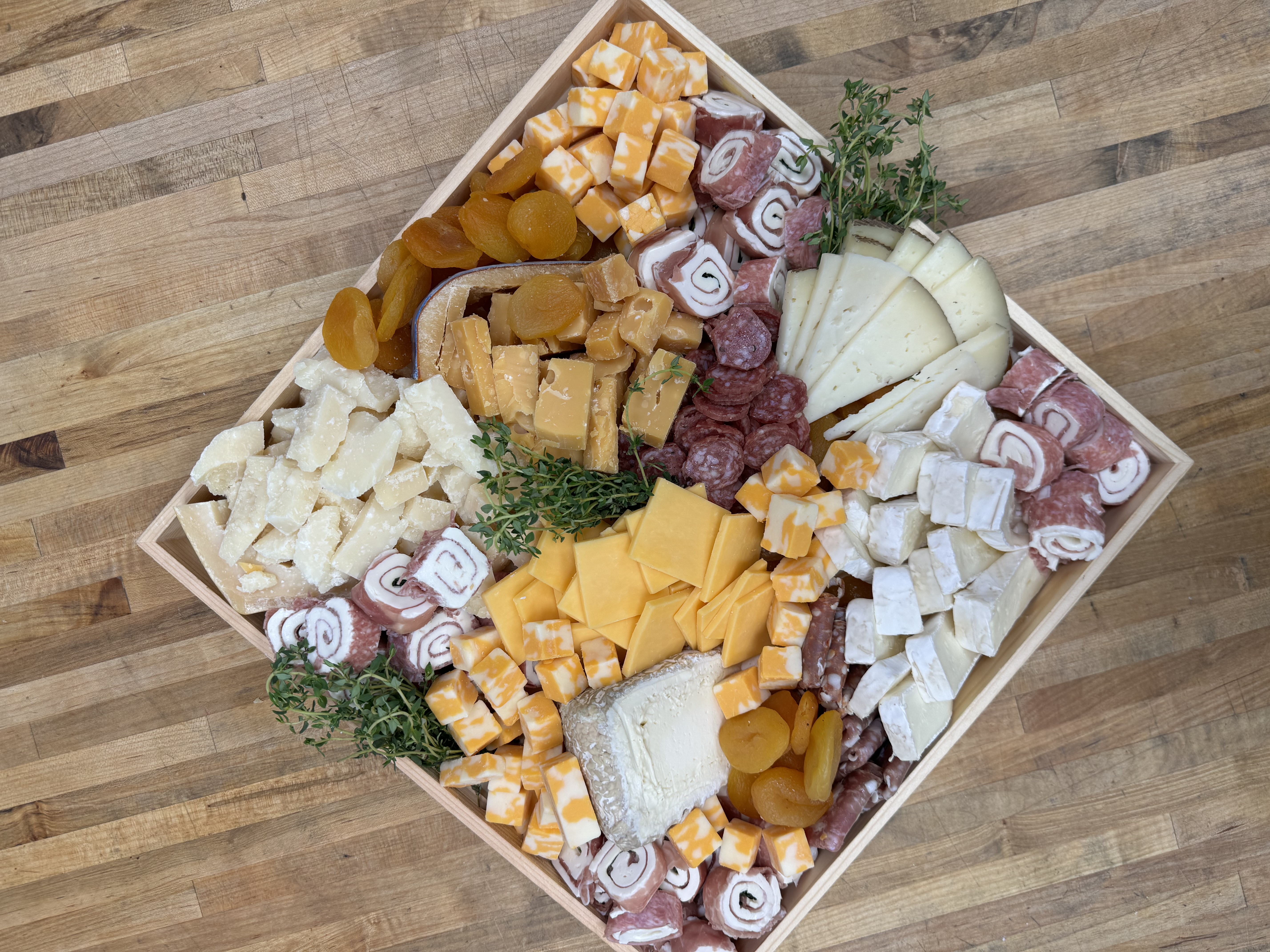 a bunch of food sitting on top of a wooden box