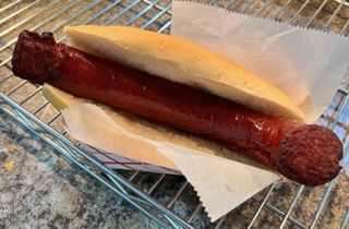 a hot dog on a bun
