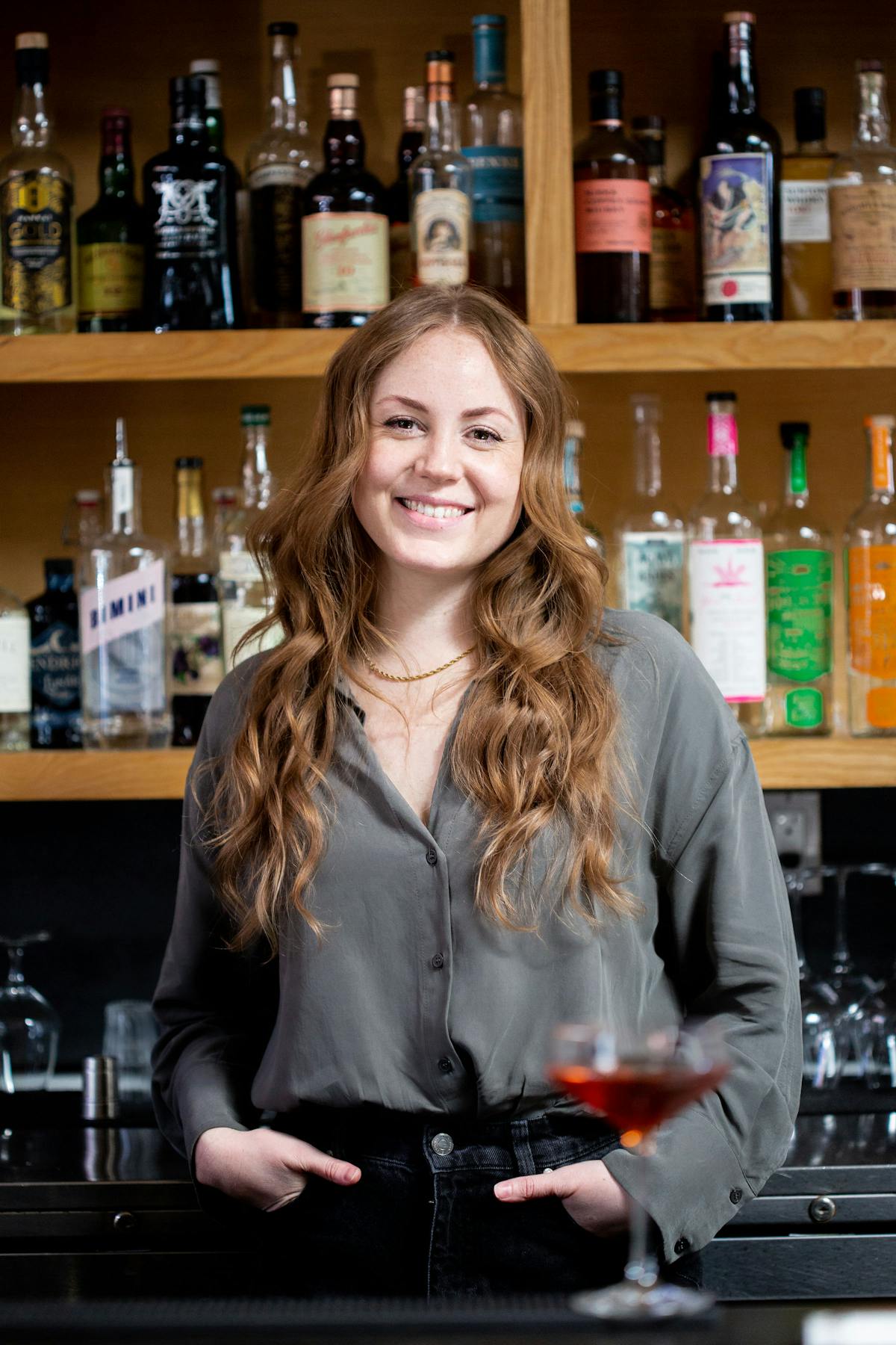 a person holding a bottle of wine